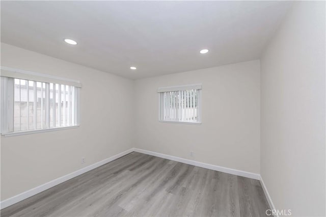 spare room featuring light hardwood / wood-style flooring