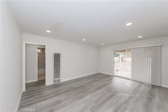 spare room with light wood-type flooring