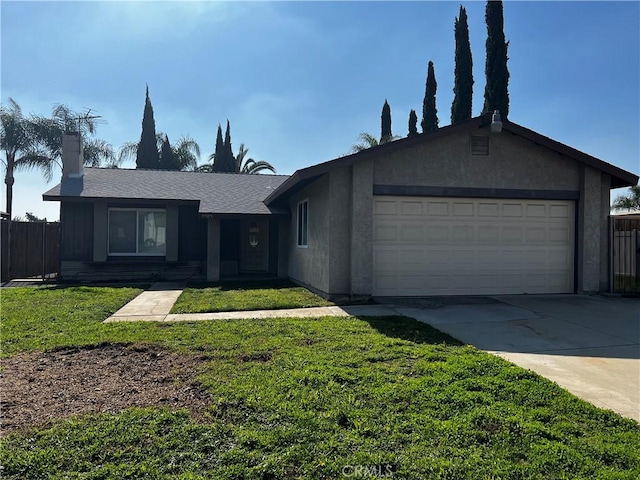 single story home featuring a garage and a front lawn