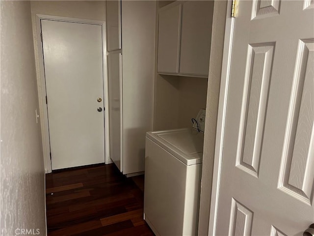 laundry area with cabinets, washer / dryer, and dark hardwood / wood-style flooring