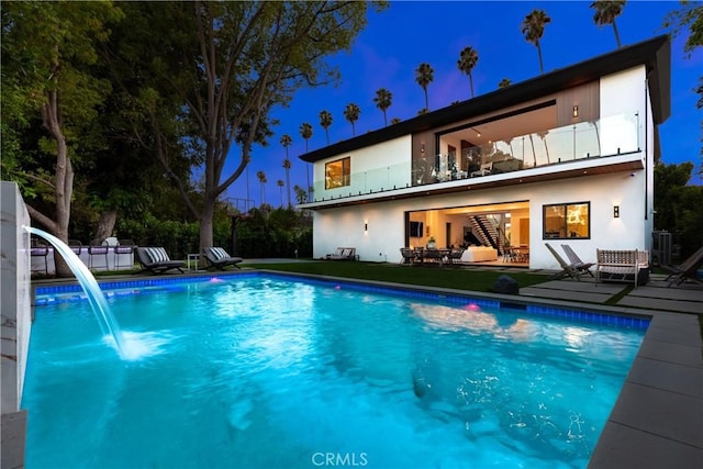 view of swimming pool featuring a patio and pool water feature