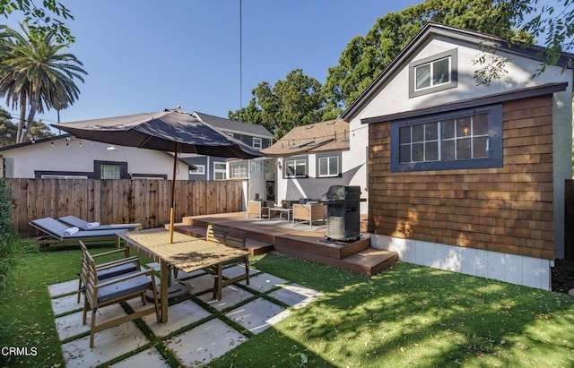 back of house with a patio, a deck, and a lawn