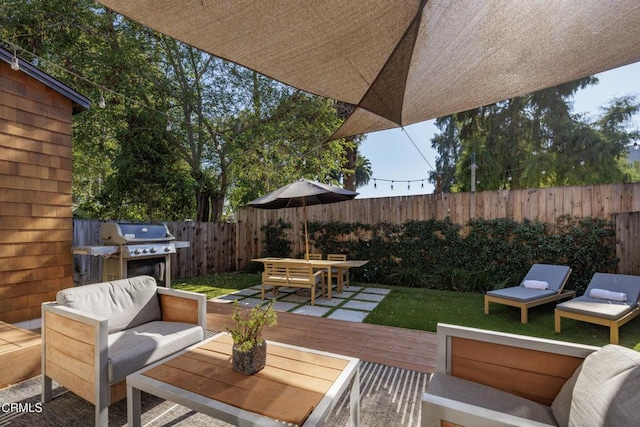 view of patio featuring a grill, a fenced backyard, an outdoor living space, outdoor dining area, and a wooden deck