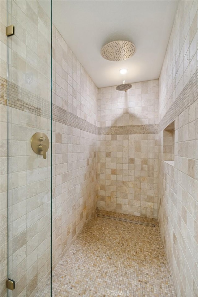 full bath with a shower stall