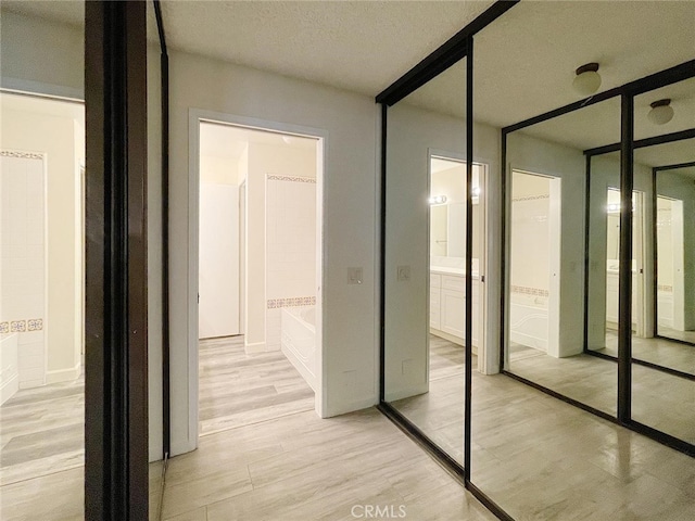 hall featuring light hardwood / wood-style flooring