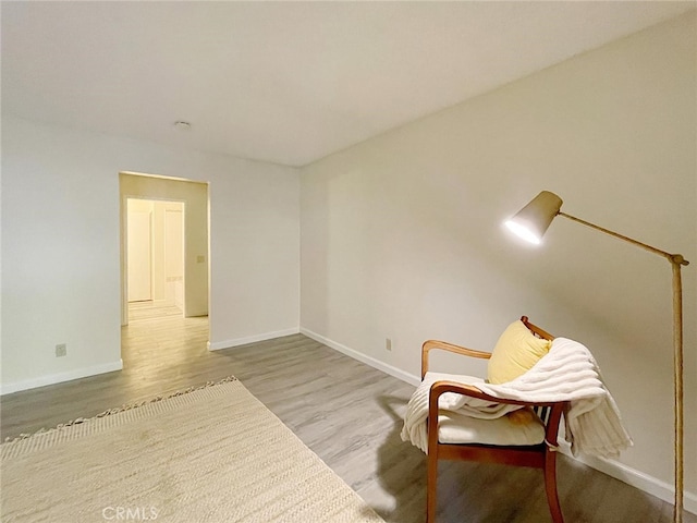 living area with light hardwood / wood-style flooring