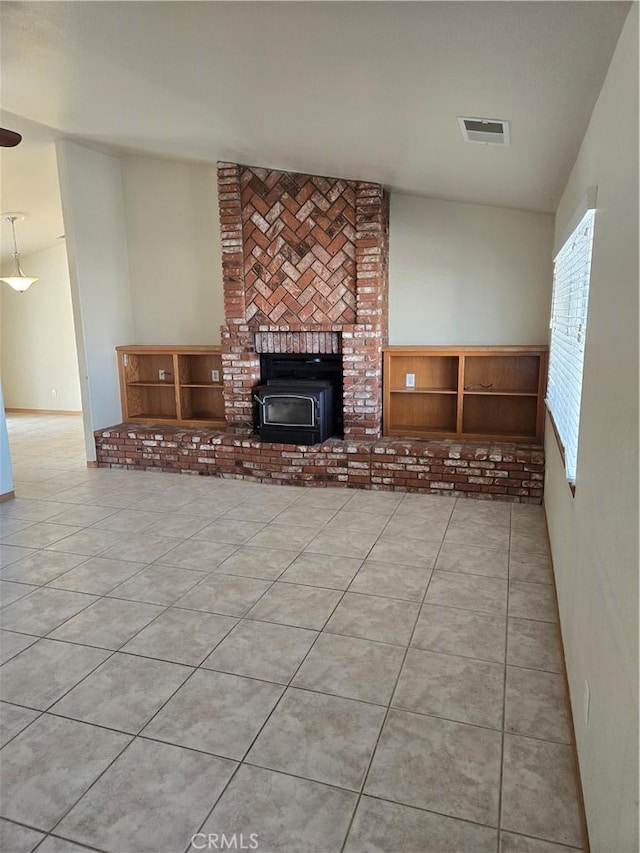 unfurnished living room featuring light tile patterned flooring