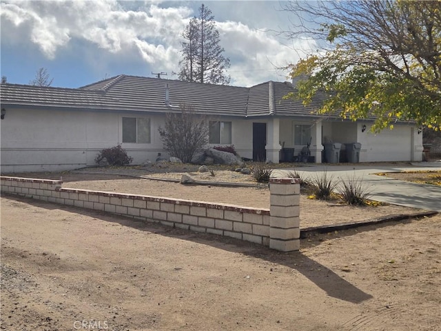 ranch-style house featuring a garage