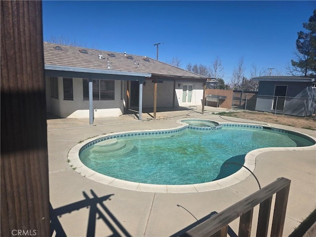 view of pool featuring an in ground hot tub, a patio, fence, and a fenced in pool