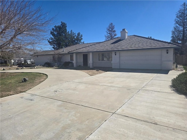 ranch-style house featuring a garage, driveway, a tiled roof, stucco siding, and a chimney