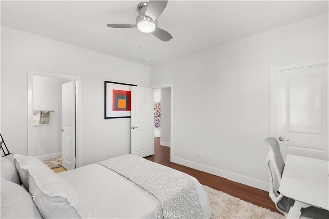 bedroom featuring dark hardwood / wood-style flooring and ceiling fan