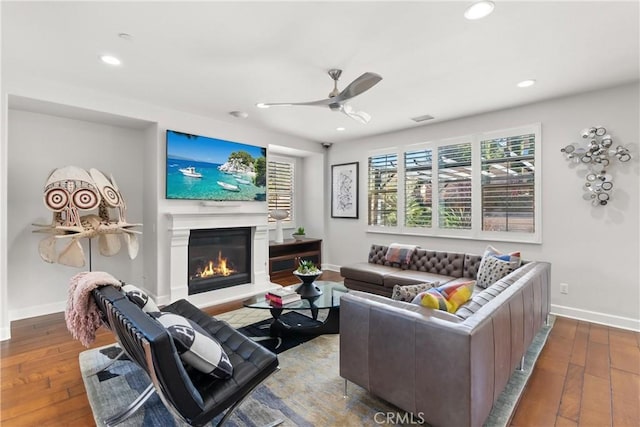 living room with hardwood / wood-style flooring and ceiling fan