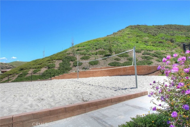 view of home's community featuring a mountain view and volleyball court