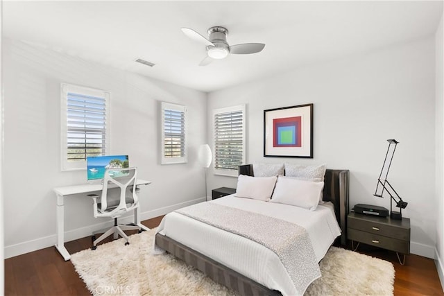 bedroom featuring ceiling fan and dark hardwood / wood-style floors