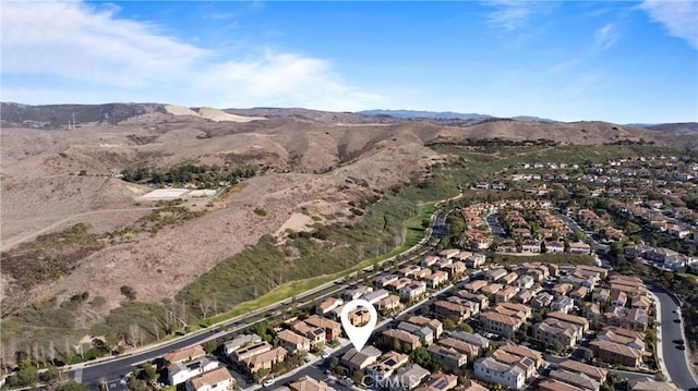 birds eye view of property featuring a mountain view