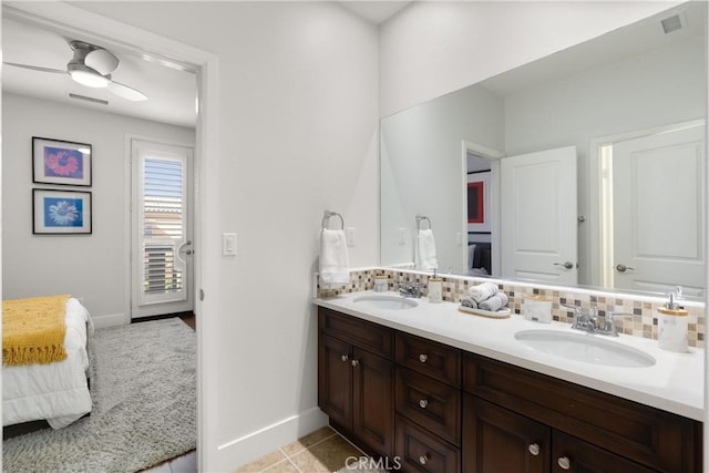 bathroom featuring tasteful backsplash, ceiling fan, vanity, and tile patterned flooring