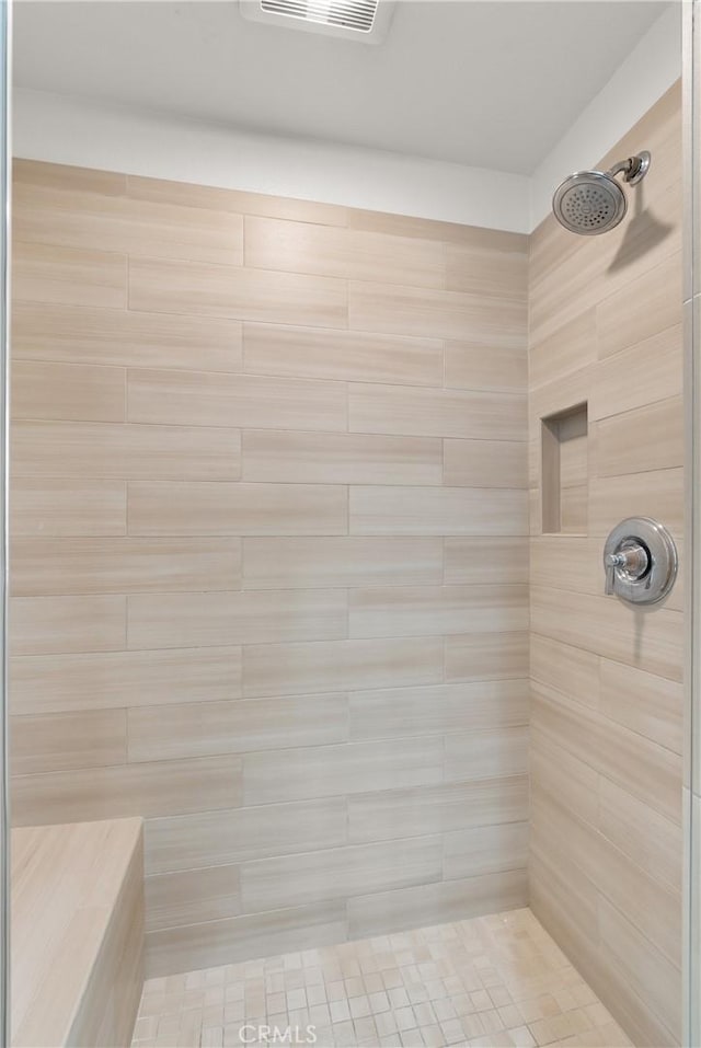 bathroom featuring a sauna, visible vents, and a tile shower