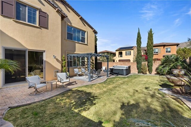 view of yard with a pergola, a hot tub, and a patio