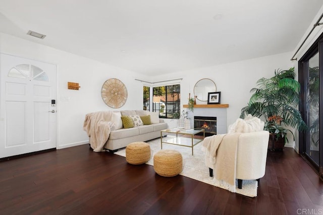 living room featuring dark hardwood / wood-style flooring