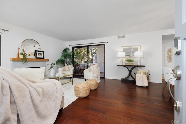 living room with dark hardwood / wood-style floors