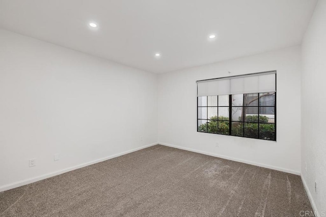 unfurnished room featuring carpet flooring