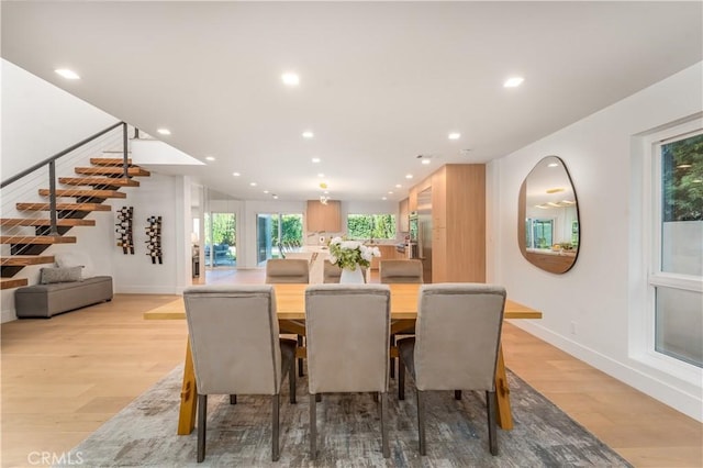 dining area featuring light wood-type flooring