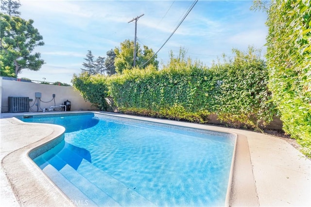 view of pool featuring central AC