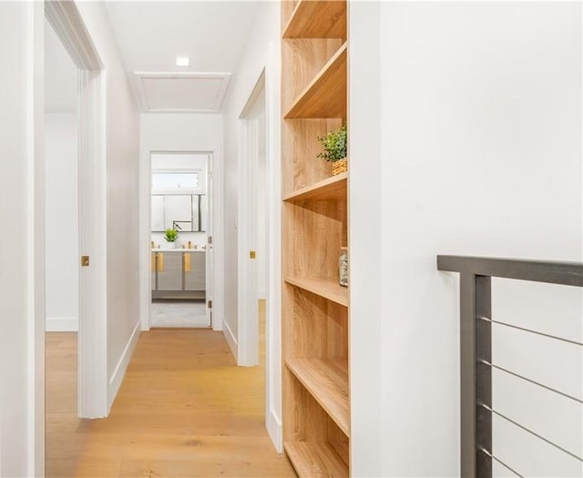 corridor with light hardwood / wood-style flooring