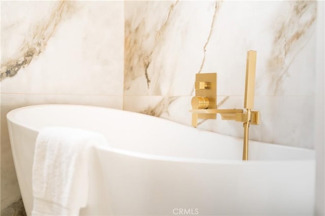 bathroom with a washtub