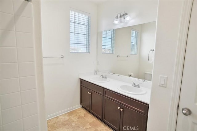 bathroom with vanity and toilet