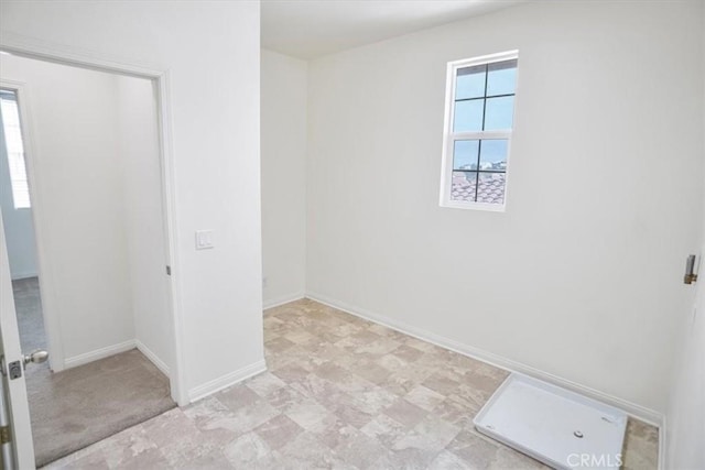 spare room featuring a healthy amount of sunlight