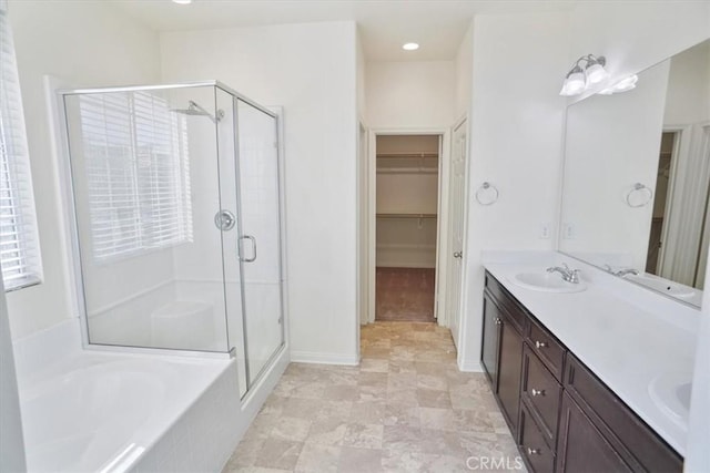 bathroom with vanity and plus walk in shower