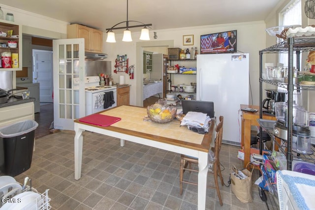 kitchen featuring crown molding, light brown cabinets, white appliances, and decorative light fixtures