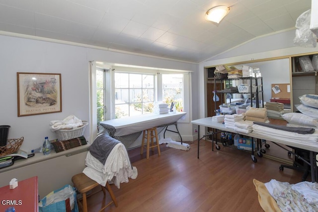 office space with vaulted ceiling and dark hardwood / wood-style floors