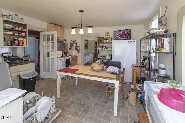 dining space featuring crown molding