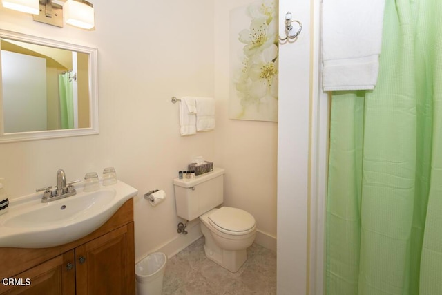 bathroom with vanity, tile patterned floors, and toilet