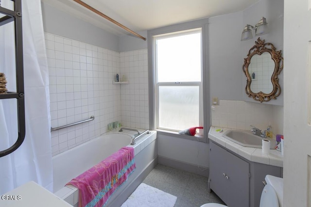 full bathroom with vanity, a wealth of natural light, shower / bath combination with curtain, and toilet