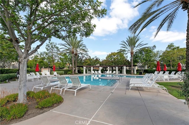 view of swimming pool featuring a patio area