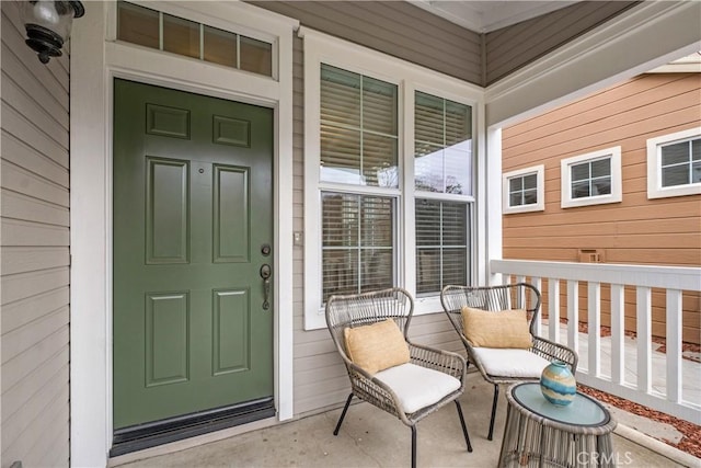 doorway to property featuring covered porch