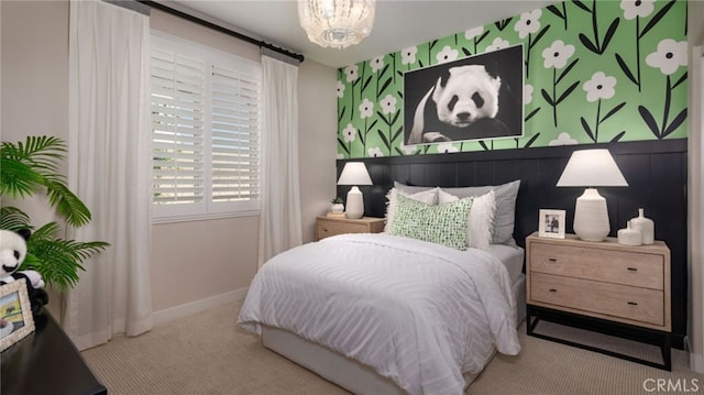 carpeted bedroom with an inviting chandelier