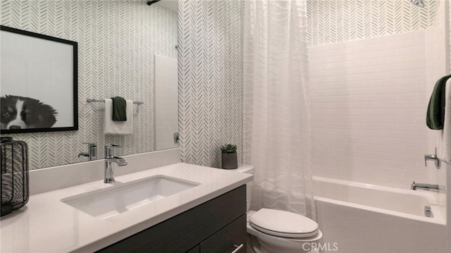 full bathroom featuring vanity, shower / bath combination with curtain, and toilet