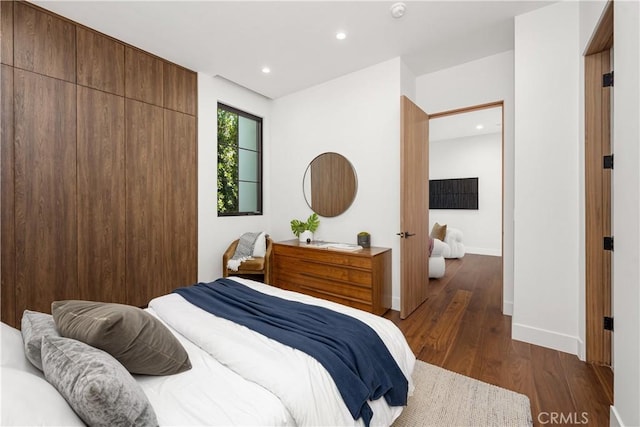 bedroom featuring dark hardwood / wood-style floors