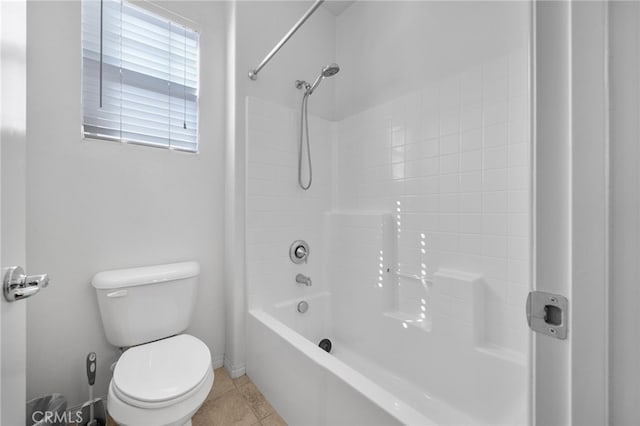 full bathroom with toilet, tile patterned flooring, and shower / bathing tub combination