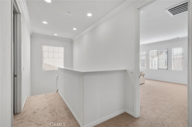 hall featuring visible vents, crown molding, light carpet, and an upstairs landing