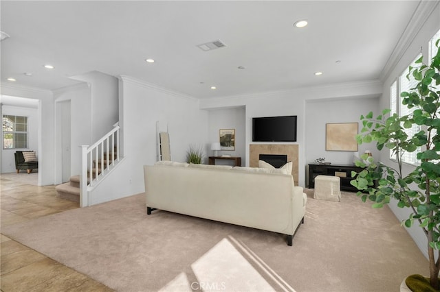 carpeted living room featuring crown molding