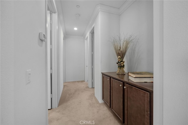 hallway with recessed lighting, light colored carpet, and crown molding