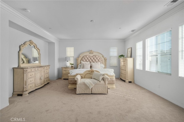 bedroom featuring ornamental molding, visible vents, and light carpet