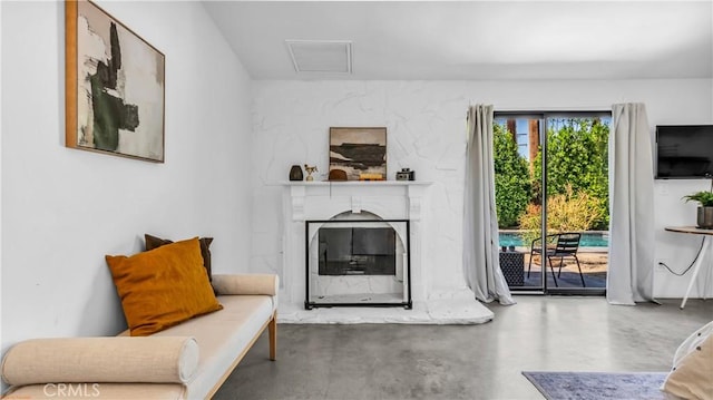 250 W Cortez Rd, Palm Springs, CA 92262 - living area featuring finished concrete flooring and a fireplace