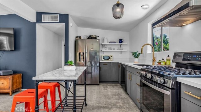 250 W Cortez Rd, Palm Springs, CA 92262 - kitchen featuring appliances with stainless steel finishes, wall chimney exhaust hood, a sink, open shelves, and finished concrete floors