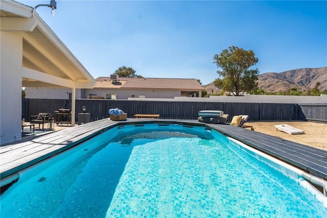 view of swimming pool featuring a mountain view